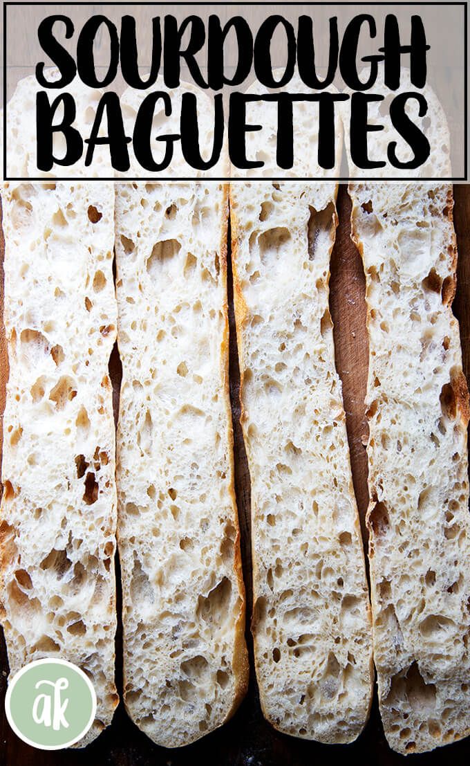 four slices of sourdough baguettes sitting on top of a cutting board