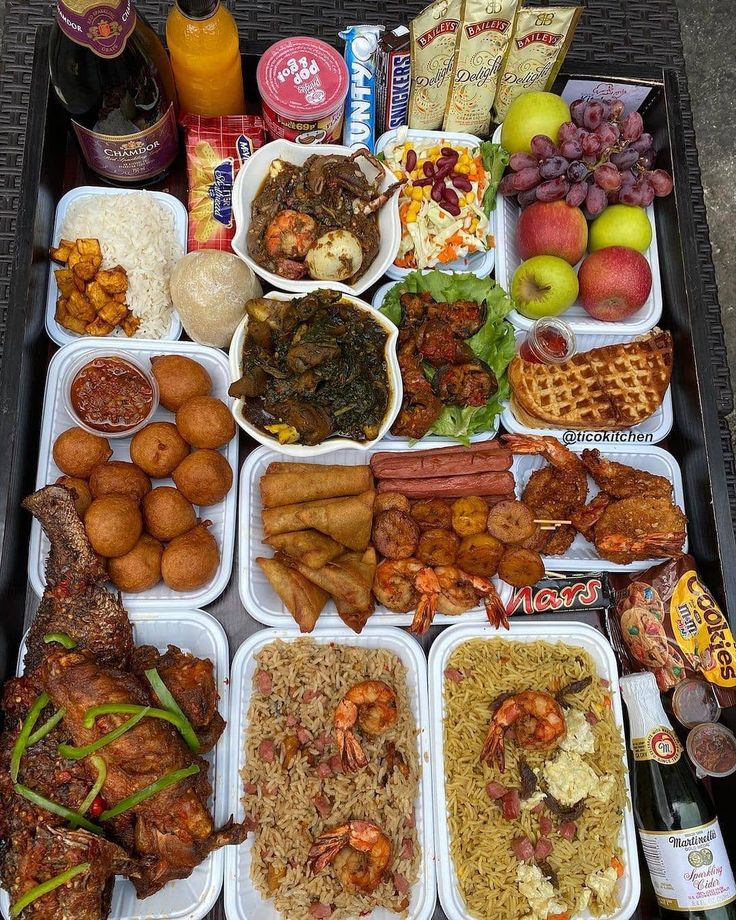 a tray filled with lots of different types of food and drinks on top of it