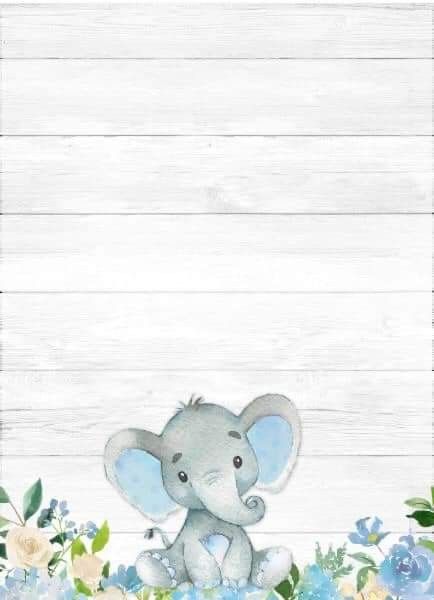 an elephant is sitting in the middle of blue flowers and greenery on a white wooden background