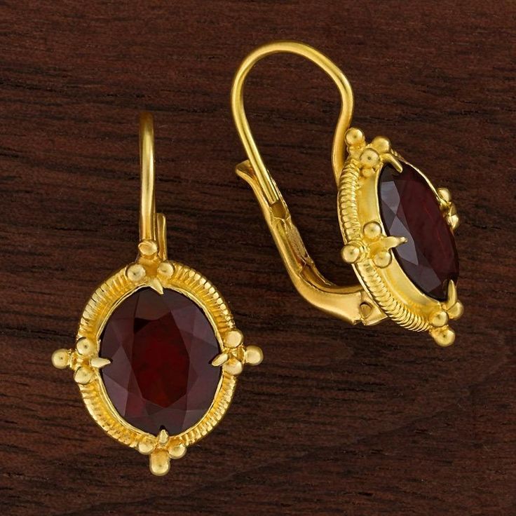 Renaissance jewelry is splendidly reborn. This ensemble belongs at a ball, or at least taken out for a night of dancing. 24k gold over sterling silver granulated settings augment the deep red sparkle of faceted garnet. European backs. Size: 1 Inch. Gold Ruby Earrings For Evening, Luxury Gold Garnet Jewelry, Elegant 22k Gold Red Jewelry, Oval Temple Jewelry For Formal Occasions, Elegant Red 22k Gold Jewelry, Elegant Yellow Gold Garnet Earrings, Polished Garnet Gold Jewelry, Classic Gold Ruby Earrings, Gold Faceted Ruby Jewelry