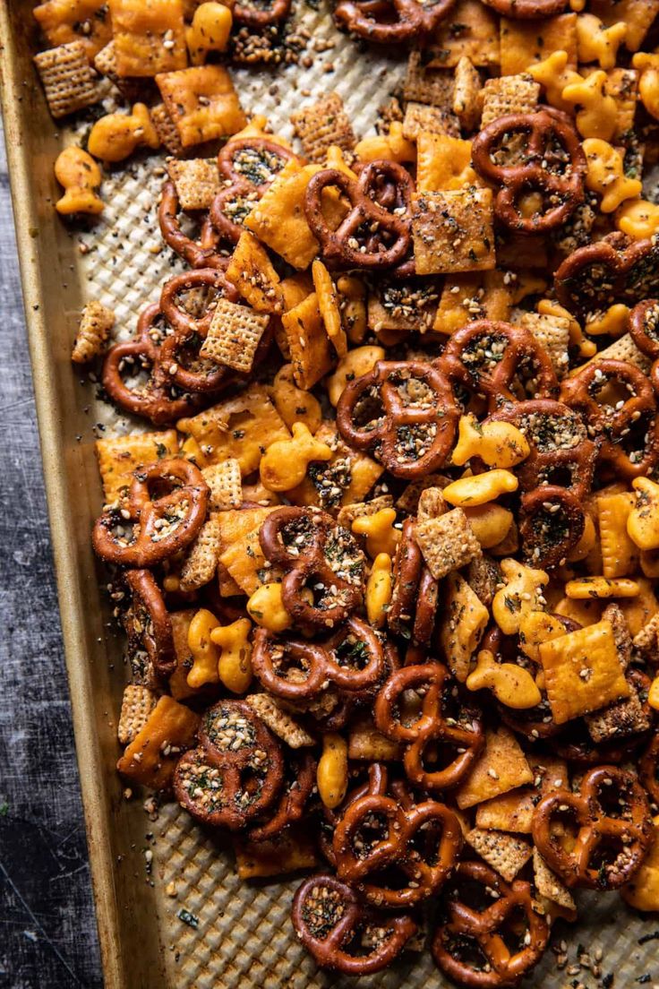 a tray filled with cheesy pretzels and crackers