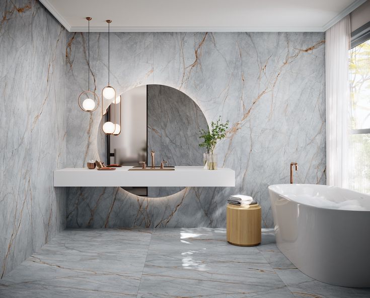 a bathroom with marble walls and flooring next to a bathtub in the corner