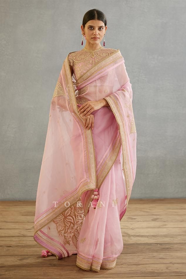 Pink saree with floral placement print and dori, sequin embroidery in floral pattern. Components: 1 Pattern: Printed, Embroidery Type Of Work: Floral, dori, sequin Fabric: Silk Organza, Cotton Silk, Butterfly Net Color: Pink Other Details:  Lace embroidered border Tassel detailing on edges Note: Blouse worn by the model is not for sale Occasion: Wedding - Aza Fashions Dori Embroidery, Silk Butterfly, Bridal Sarees South Indian, Butterfly Net, Printed Embroidery, Placement Print, Saree For Women, Saree Designs Party Wear, Embroidered Saree