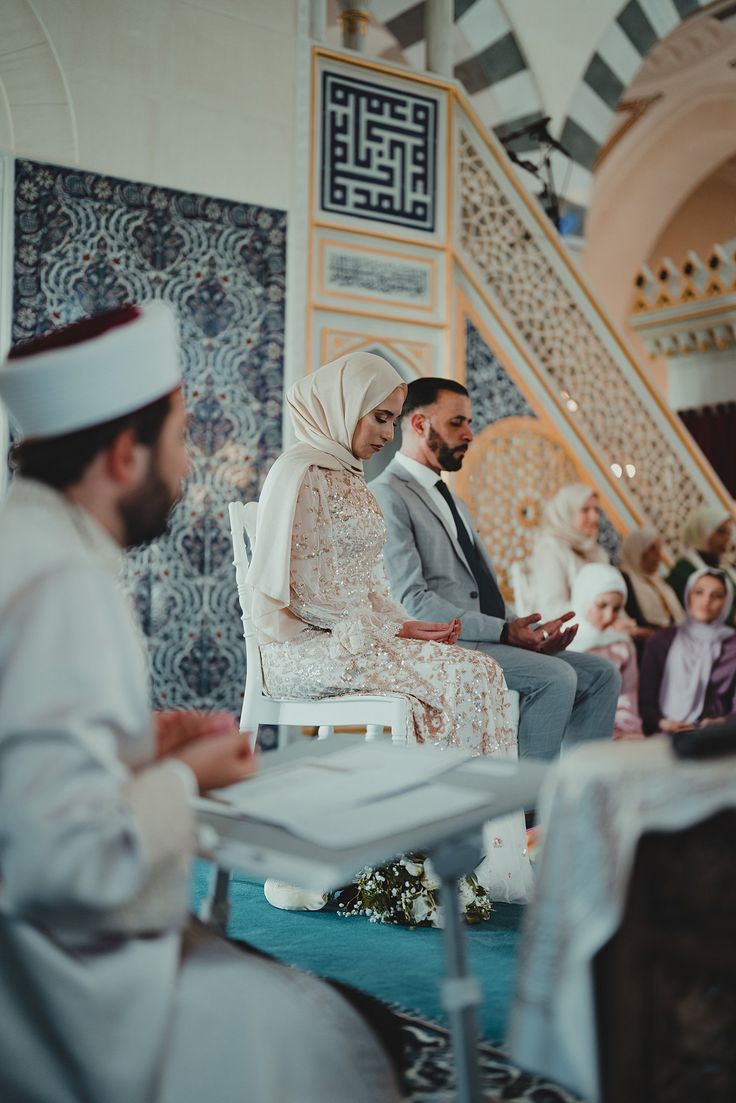 the bride and groom are waiting for their ceremony to begin