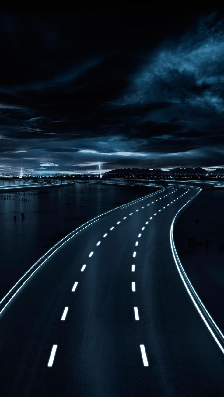 an image of a highway going into the distance at night with light streaks on it