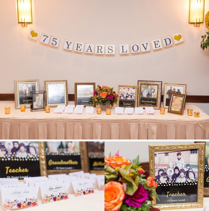 the table is set up with pictures and place cards for guests to write their names