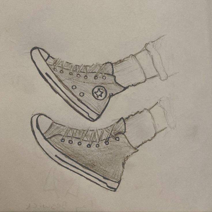 two drawings of shoes with one being drawn in pencil and the other is drawn to look like