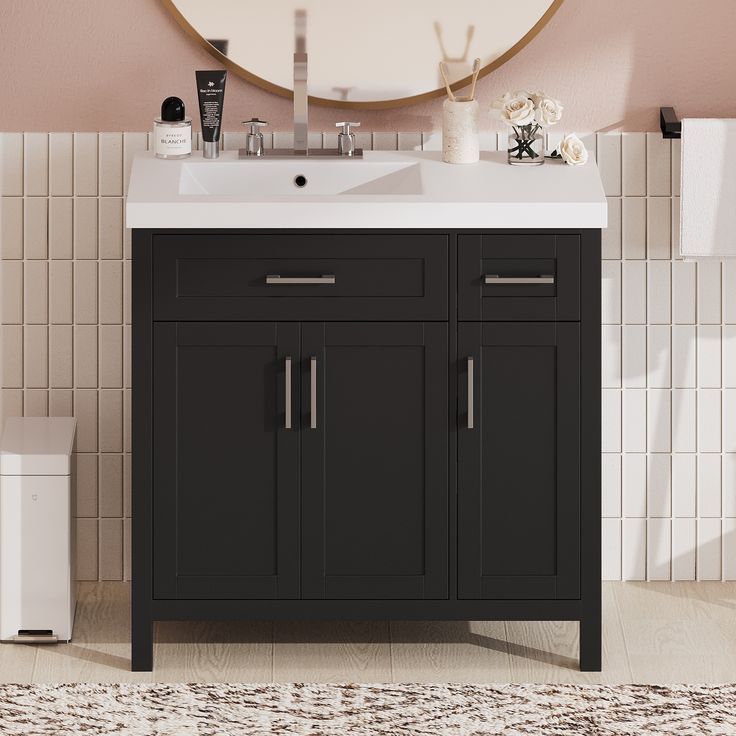 a bathroom vanity with a mirror above it and a rug on the floor next to it