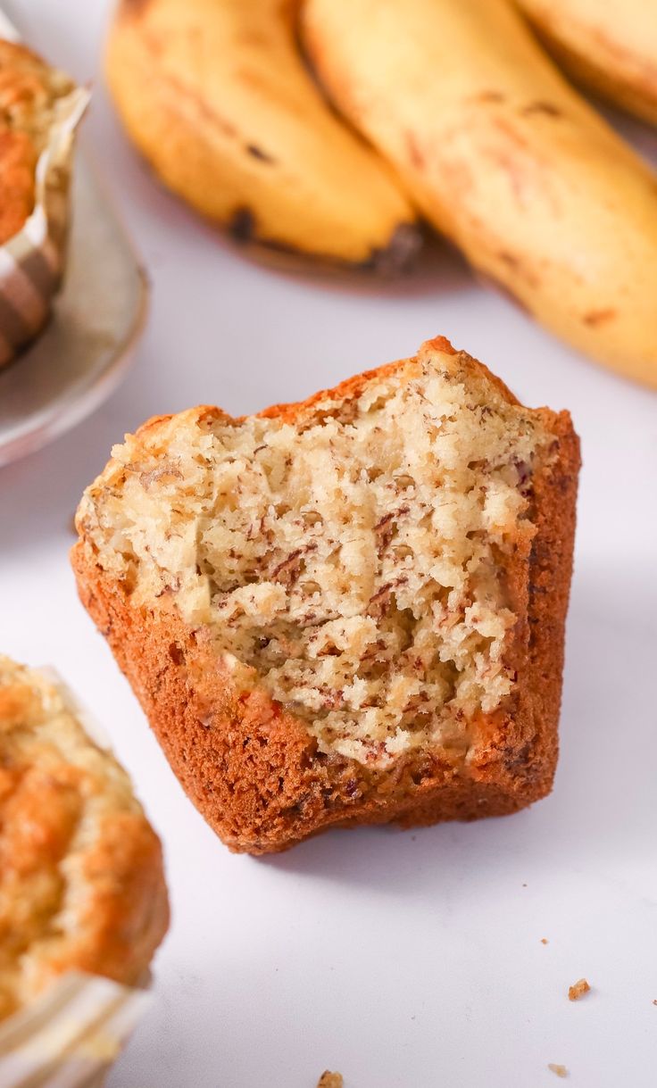 a muffin is sitting next to some bananas