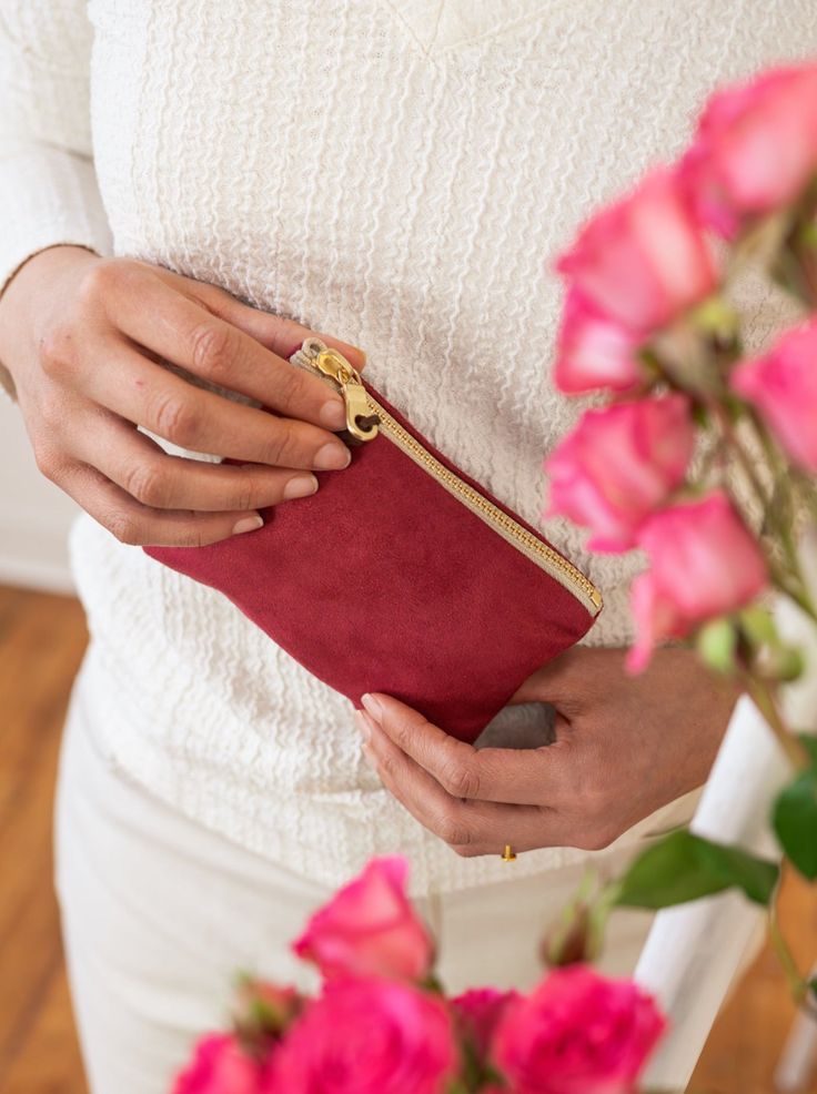 Made with a red sueded fabric, lined with a bird print cotton, and finished with a brown suede zipper pull, you'll adore this sweet and stylish little pouch. These purses are a perfect size for little things, like credit cards and cash. Your undersized items can tuck in here, and fit into a bigger purse or pocket. The sturdy brass zippers make them easy to use. 5.5" X 3.75" Designed and handmade at the Ash & Rose studio in Massachusetts Limited edition Red Cosmetic Bag With Zipper Closure - Gift, Red Cosmetic Bag With Removable Pouch As Gift, Gift-ready Red Cosmetic Bag With Removable Pouch, Red Bag With Zipper Pocket For Gift, Red Zipper Closure Pouch For Everyday Use, Red Zipper Pouch Cosmetic Bag, Red Pouch With Card Slots For Daily Use, Red Wallets With Zipper Pouch For Everyday, Everyday Red Pouch Cosmetic Bag