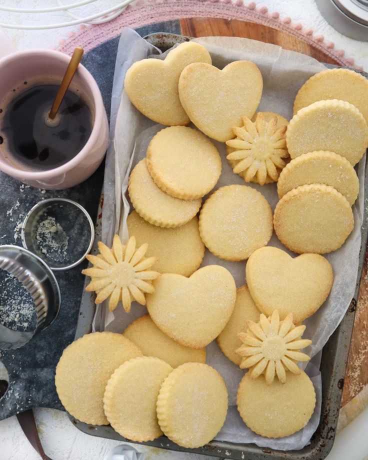 some heart shaped cookies are on a tray