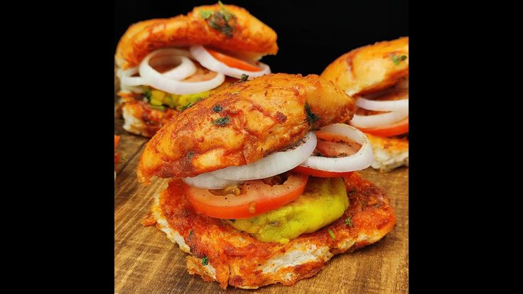 chicken sandwich with onions and tomato slices