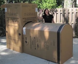 a woman standing next to a mail box