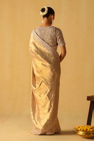 Brocade gold saree with floral dabka zardosi embroidered border. Paired with a floral jaal embroidery. - Aza Fashions Gold Pre-draped Saree For Reception, Elegant Zari Weaving Blouse For Reception, Elegant Tussar Silk Blouse With Dori Work, Gold Blouse With Zari Weaving For Wedding, Gold Saree With Unstitched Blouse For Reception, Elegant Blouse With Zari Weaving For Reception, Gold Pre-draped Saree With Resham Embroidery For Reception, Gold Cutdana Blouse For Eid, Eid Gold Blouse With Cutdana