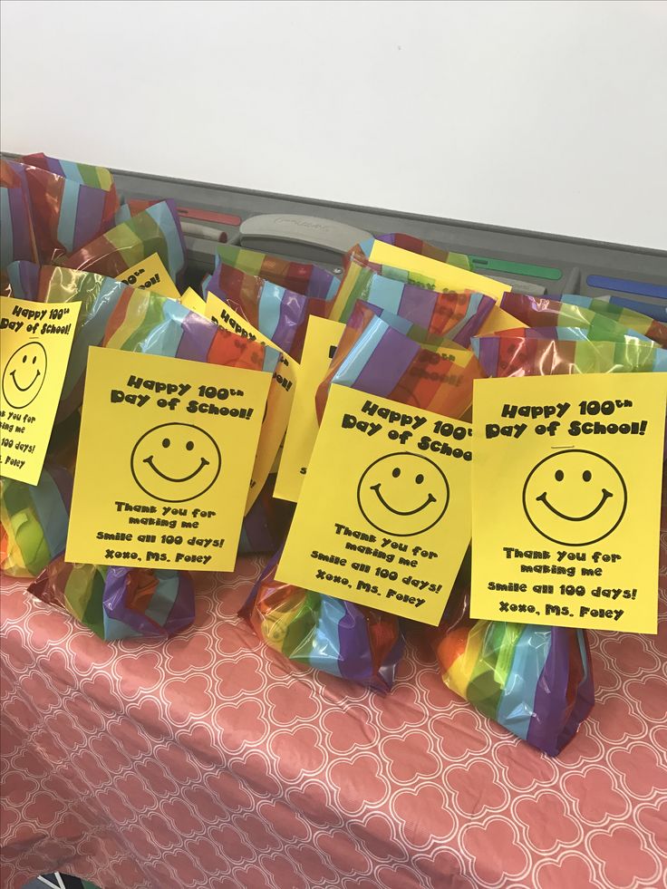 colorful bags with notes on them sitting on a table