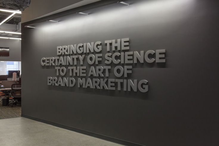 an office wall with the words bring the creativity of science to the art of brand marketing