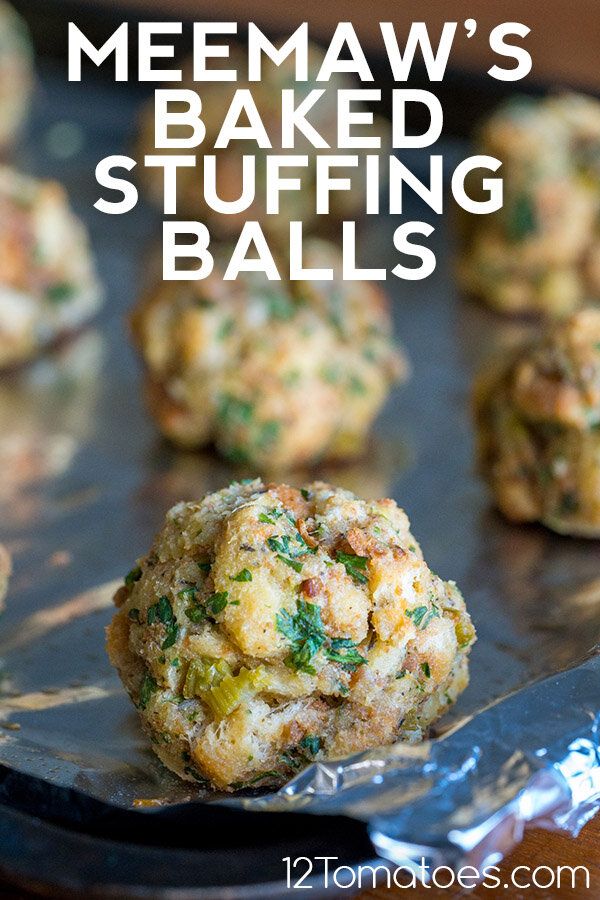 some food that is on top of a metal pan and has the words memaw's baked stuffing balls in it