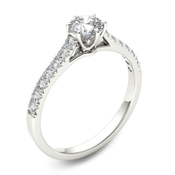 a white gold engagement ring with diamonds on the side