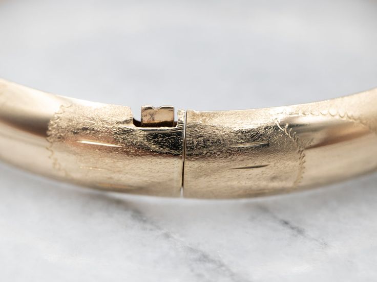 This vintage bracelet is in excellent condition, with very little wear to the engraved dome and a soft, gentle finish.Metal: 14K Yellow Gold Width: 8.3 mmInside Diameter: 6 1/2 Inches Marks: "14KP" Stamped on the clasp Channel Set Diamond Band, Engagement Ring Diamond Cut, Blue Tourmaline, Vintage Bracelet, European Cut Diamonds, Oval Cut Diamond, Art Deco Diamond, Diamond Drops, Halo Diamond Engagement Ring