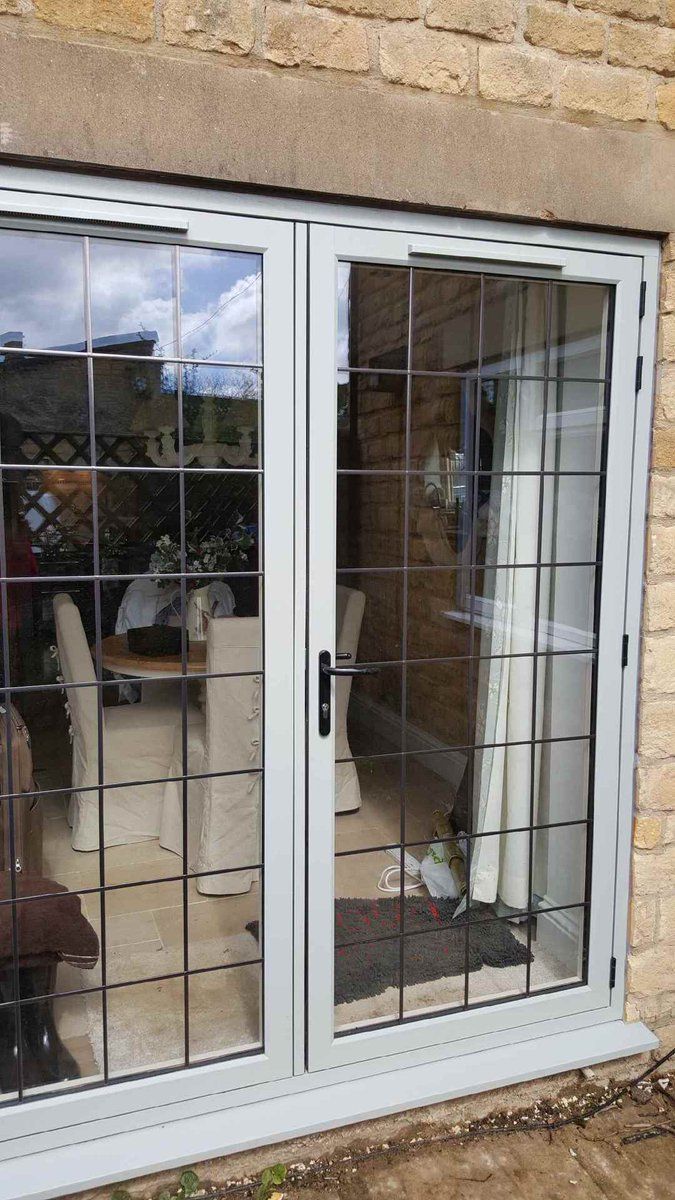 an image of a patio door that is being used as a screen for the outside