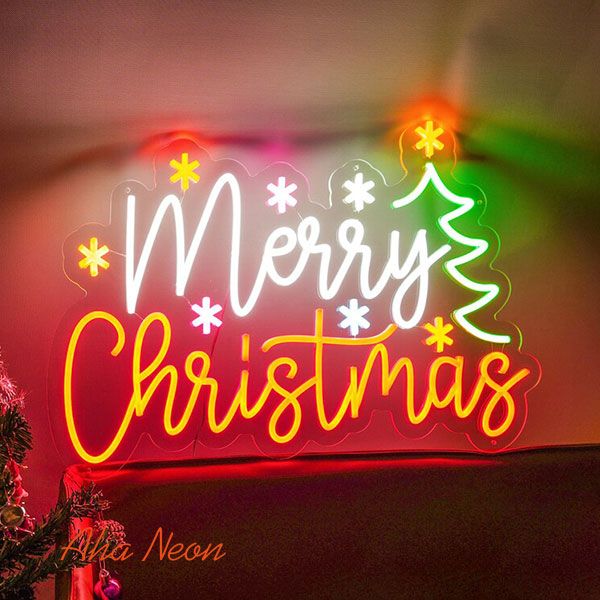 a neon sign that says merry christmas on it