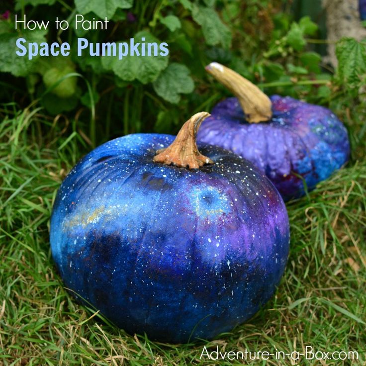 two painted pumpkins sitting in the grass with text overlay that says how to paint space pumpkins