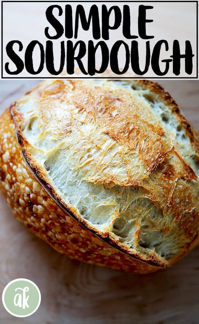 a loaf of sourdough sitting on top of a cutting board with the words simple sourdough written above it