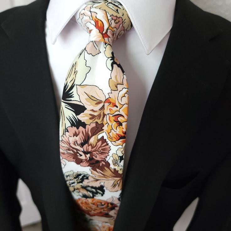 Treat yourself with a new pattern and splash of color to your look with this unique tie. 100% Cotton Handmade Package Includes: Tie Length: 59" Width: 3" Warm iron if needed White Ties Neckwear For Spring, White Neckwear With Ties For Spring, Multicolor Suit And Tie Accessories For Spring Formal, Multicolor Suit And Tie Accessories For Formal Spring Events, Multicolor Floral Print Wedding Ties, Multicolor Summer Ties For Formal Occasions, Multicolor Standard Tie For Summer, Elegant Multicolor Floral Print Suit And Tie Accessories, Elegant Multicolor Ties For Spring