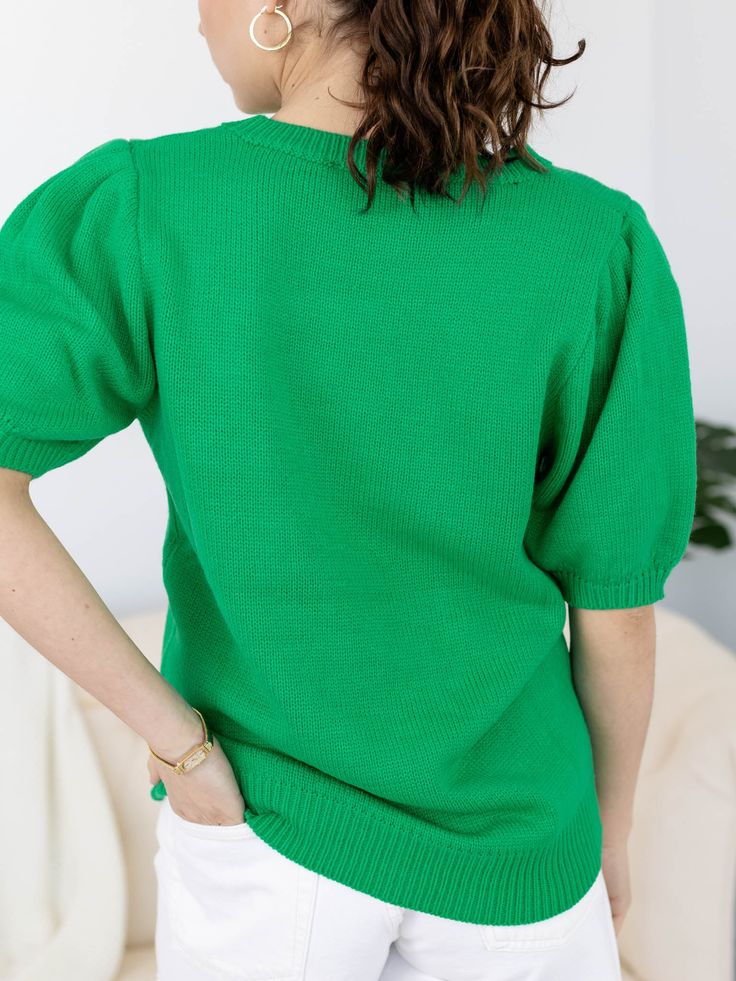 This short sleeve knit sweater features a puff sleeve accent to add a stylish, feminine flair to the look. Sequins make up a script LUCKY and four leaf clover sitting front + center, making this a super cute and fun way to style your St. Patricks Day attire! Sequin accent St. Patricks Day inspired Puff sleeve silhouette Short sleeve sweater silhouette 100% Acrylic Body length measurement: 26" from a S. Bust measurement: 19" from a S. Model is wearing a S. // { const scriptElement = document.querySelector('script[data-lyvecom]'); scriptElement.addEventListener('load', () => { LyveComWidget.mountCarouselComponent({ carouselID: '65d778117957d5853f13e925', parentElement: '.lyvecom_carousel--component', carousel: true, bubbles:true, lng: 'en' }); })})() // ]]> Trendy Knit Top With Puff Sleeves, Green Short Sleeve Sweater For Fall, Spring Textured Knit Short Sleeve Sweater, Solid Short Sleeve Sweater For Summer, Casual Solid Color Knit Top With Puff Sleeves, Solid Short Sleeve Summer Sweater, Trendy Short Sleeve Puff Sleeve Top For Fall, Trendy Puff Sleeve Top For Fall, Trendy Puff Sleeve Short Sleeve Top For Fall