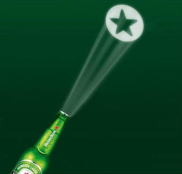 an advertisement for heineken beer with a star on the top and green background