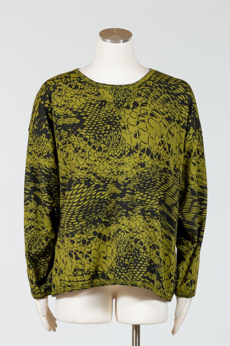 Revamp your wardrobe with our Prairie Cotton Sweatshirt. This lightweight French Terry cotton sweatshirt boasts a wide crewneck and long sleeves, creating a loose and boxy fit that falls high on the hips. Its casual, comfortable and stylish design makes it a must-have for any fashion-savvy individual. Available in a moss green color with an abstract black animal print. No pockets. Made in USAFabric: 100% CottonCare: Machine Wash Cold, Tumble Dry LowMedium - Bust 52", Hips 50", Length 25" Moss Green Color, Black Animals, Dress Form, Size 6 Dress, Moss Green, New Shop, Stylish Design, French Terry, Green Color