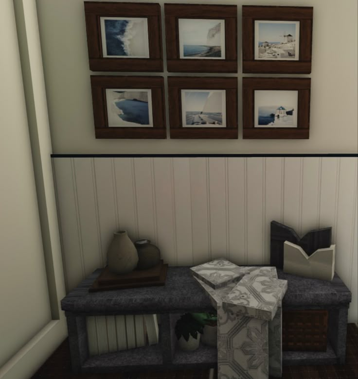 there is a bench in the room with pictures on the wall