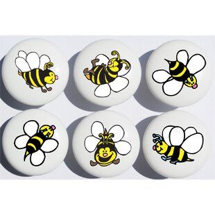 six bees are painted on the side of white eggs