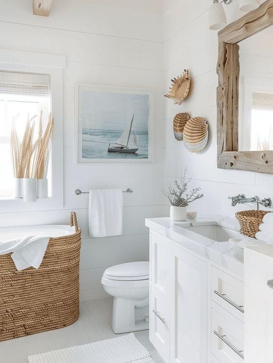 a white bathroom with wicker baskets on the wall