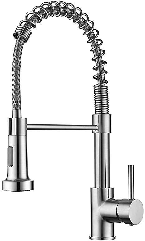 a kitchen faucet that is attached to the side of a sink with an arm spout