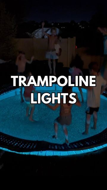 some people are dancing around in the pool at night with text reading trampoline lights