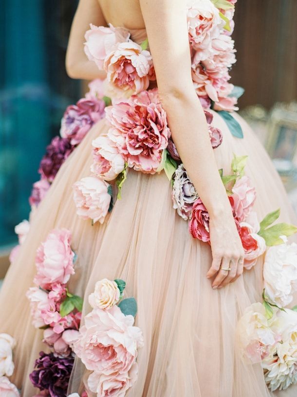 a woman in a dress with flowers on it's back and the words pinter