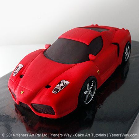 a red sports car cake sitting on top of a black table with the words cakestorys