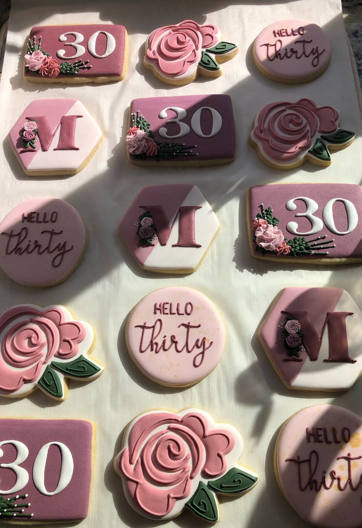 decorated cookies are arranged in the shape of letters and numbers