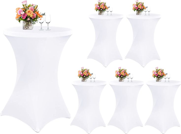 six white tables with flowers and wine glasses