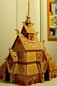 a gingerbread house made to look like it is in the shape of a church