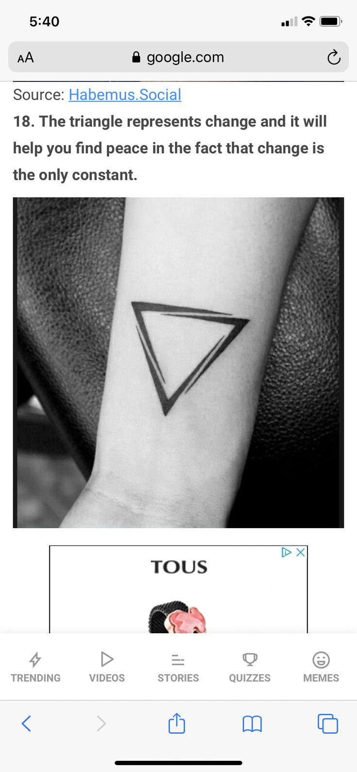 a black and white photo of a small triangle tattoo on the left wrist, with text below it