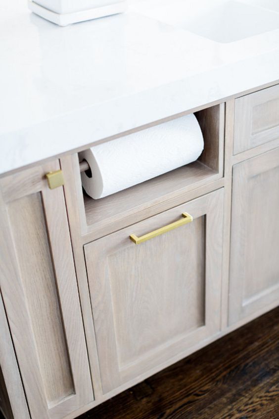 a bathroom counter with two rolls of toilet paper on it