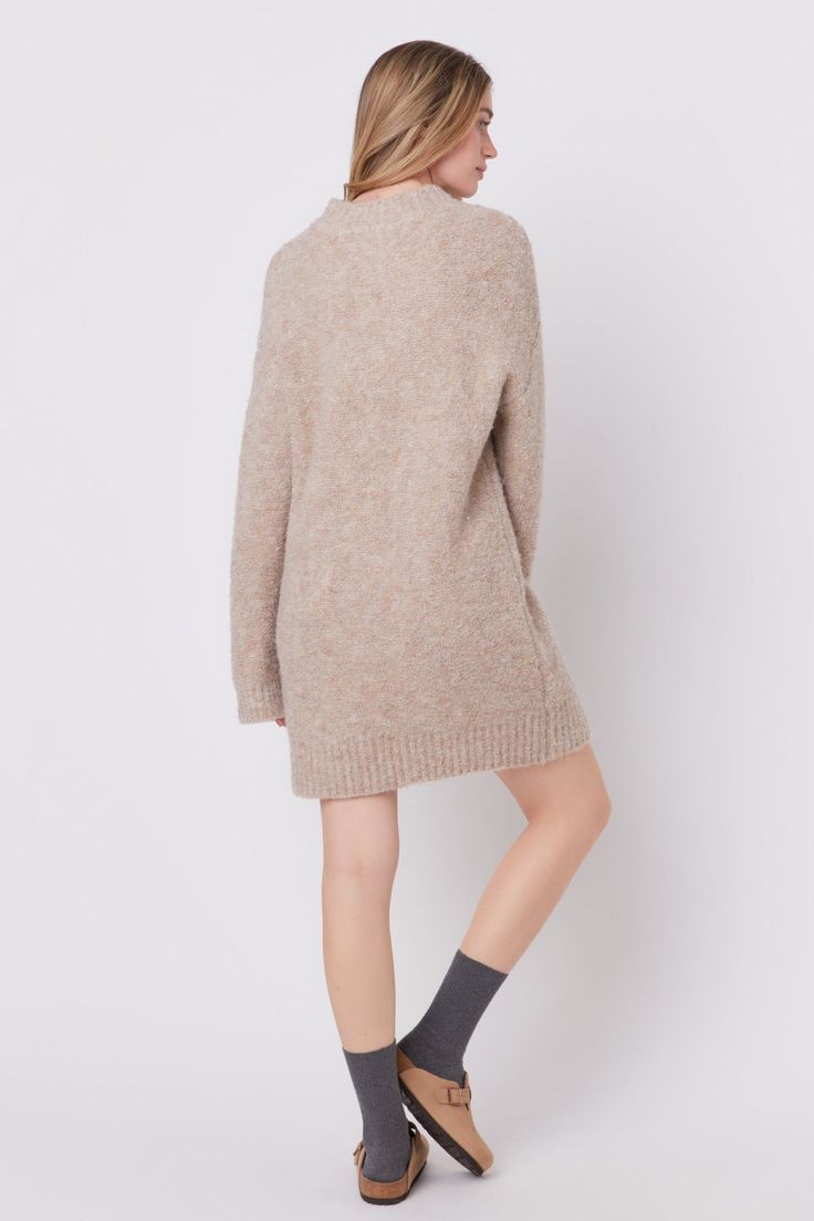 Introducing our luxurious Long-Sleeved Sweater Dress, perfect for keeping you warm while looking chic this season. Made from a fluffy textured knit fabric, it is both soft and cozy to the touch. The round neckline and long sleeves add a touch of elegance, while the drop shoulder detailing adds a modern twist. This versatile dress can be dressed up or down for any occasion, making it a must-have in your wardrobe. With its trendy design and comfortable fit, our Long-Sleeved Sweater Dress is sure to be your go-to choice. Shop now and stay stylishly comfortable all day long. Furry textured knit fabric Round neckline Long sleeves Drop shoulder Shell: 50% Polyester 20% Acrylic 18% Nylon 10% Wool 2% Spandex TL291D Total length: 31.75", Bust: 40" S Height 5'10.5" / Bust 32" / Waist 24" / Hip 36.5" Fall Chunky Knit Crew Neck Sweater Dress, Fall Crew Neck Sweater Dress In Soft Knit, Fall Crew Neck Soft Knit Sweater Dress, Fall Soft Knit Sweater Dress With Crew Neck, Chic Fall Sweater Dress With Crew Neck, Chic Crew Neck Sweater Dress For Fall, Textured Knit Long Sleeve Sweater Dress, Cozy Textured Knit Long Sleeve Sweater Dress, Cozy Long Sleeve Textured Sweater Dress