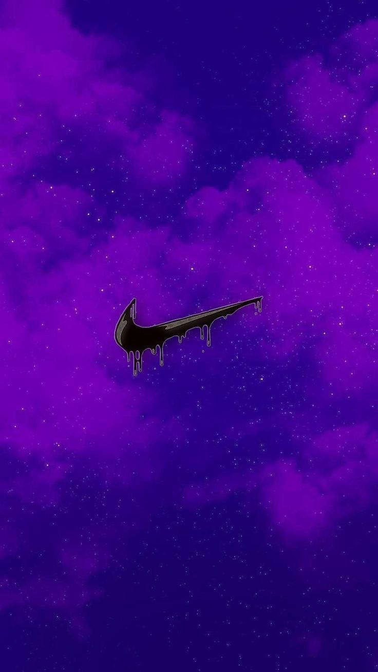 an airplane is flying through the sky with purple clouds and stars in the night time