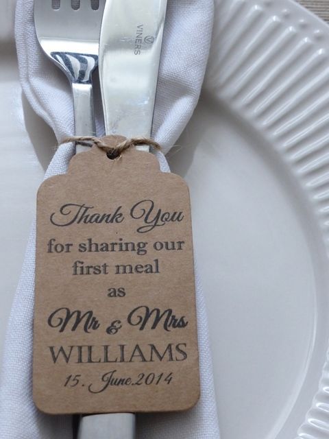 a white plate topped with a silverware fork and a tag that says thank you for sharing our first meal as mr and mrs williams