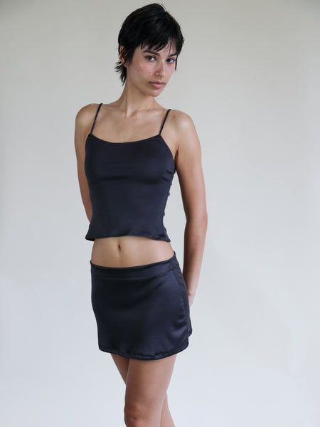 Black Fitted Satin Mini Skirt, Fitted Black Satin Mini Skirt, Chic Satin Summer Sets, Chic Summer Satin Sets, Black Silk Skirt For Summer, Black Fitted Silk Skirt, Fitted Black Silk Skirt, Fitted Silk Skirt For Date Night, Fitted Silk Skirt For Night Out