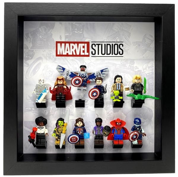 lego minifigures are arranged in a shadow box to look like superheros