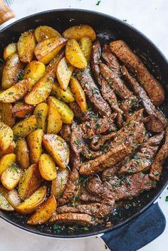 a skillet filled with steak and potatoes on top of a white tablecloth next to an instagram post