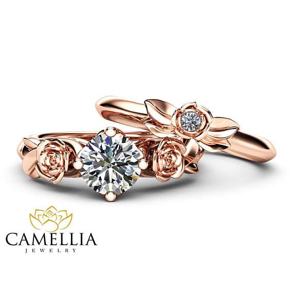 two rose shaped engagement rings, one with a diamond in it and the other with a flower